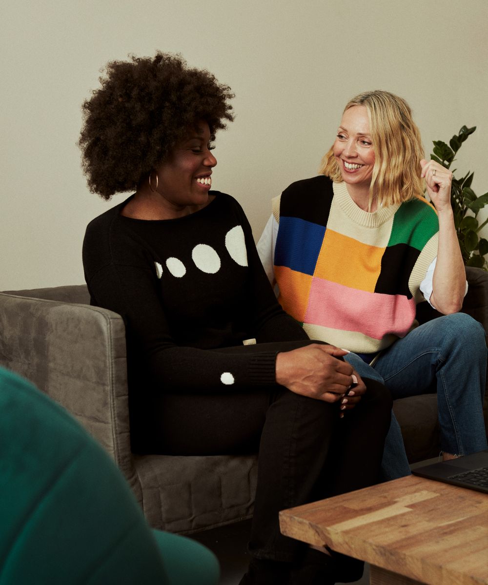 Two people talking and laughing together