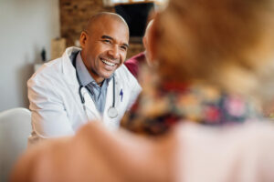 African American doctor providing compassionate support during heroin rehab in Itasca, IL at Fox Valley Behavioral Health.