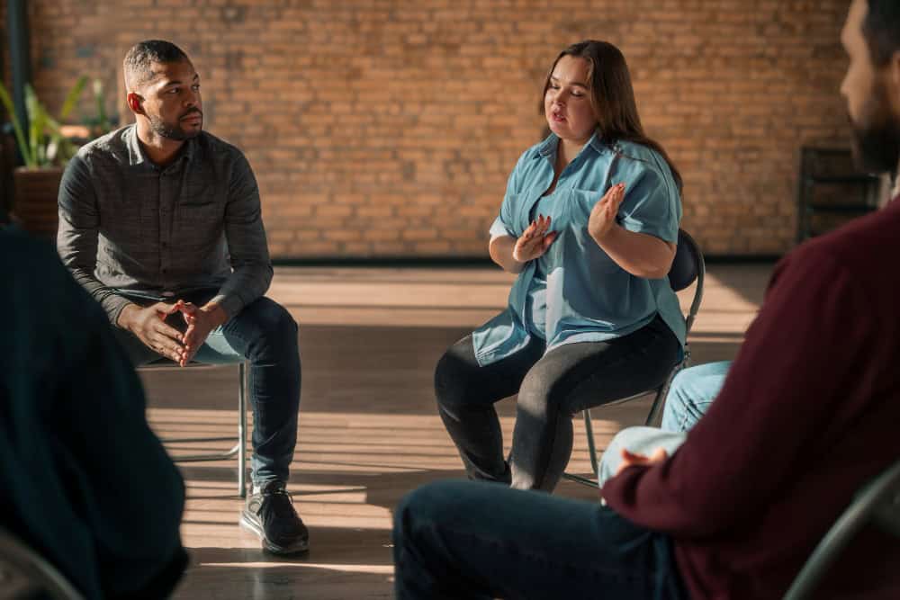 People participating in a psychological therapy support group in Elk Grove Village, IL.